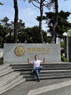 Posing in front of the Yonsei University entrance sign in Seoul, South Korea